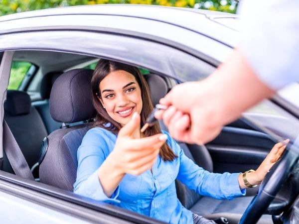 Woman Receiving Car Keys