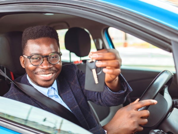 Man Driving a Blue Car